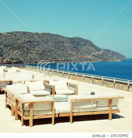 Terrace seaview with lounge sofa in luxury resort 19520992