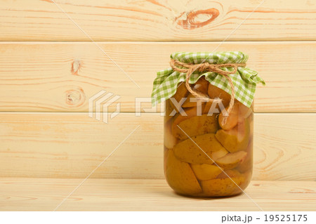 One jar of pear compote at beige vintage wood One jar of pear compote at beige vintage wood 19525175