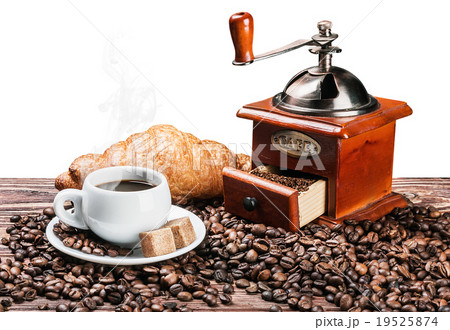 cup of warm coffee and coffee grinder isolated 19525874