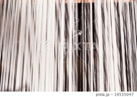 white silk thread in sewing or weaving machine white silk thread in sewing or weaving machine 19535047