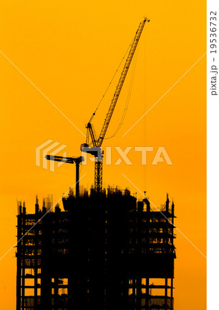 construction cranes and building silhouettes 19536732