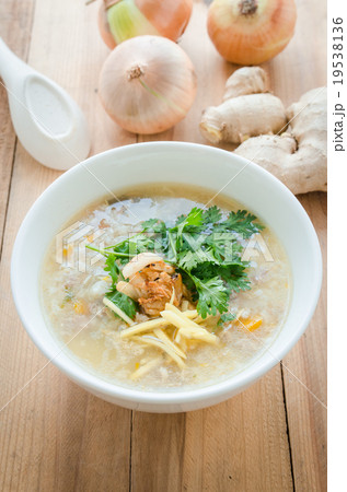 Boiled rice in pork soup with sliced ginger 19538136