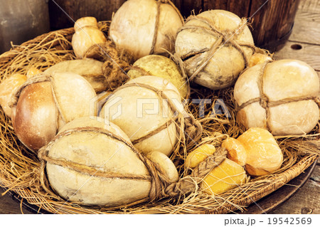 Yellow decorative pumpkins in the wicker basket 19542569
