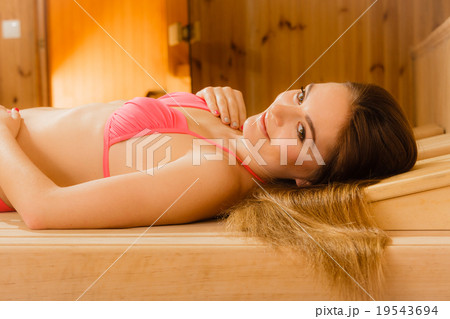 Portrait of woman relaxing in sauna. Spa wellbeing Portrait of woman relaxing in sauna. Spa wellbeing 19543694