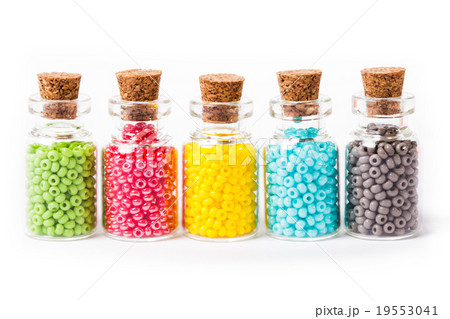 Colorful beads in the bottles 19553041