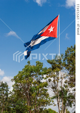 The Cuban state flag flutters on a wind.  19553411