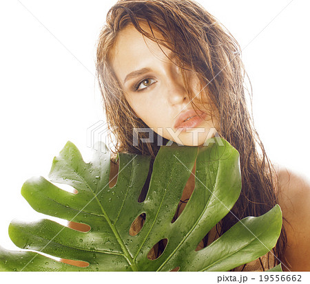 young brunette elegant woman with green leaf young brunette elegant woman with green leaf 19556662