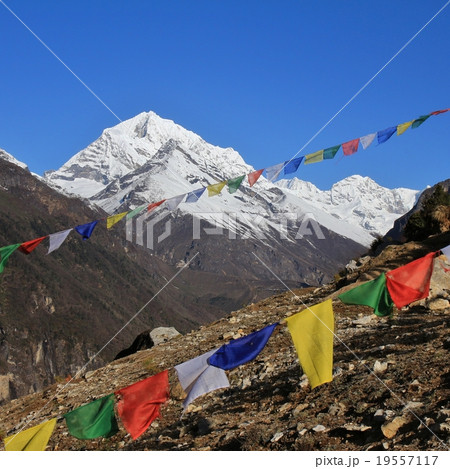 Prayer flags and mountain in the Himalayas 19557117