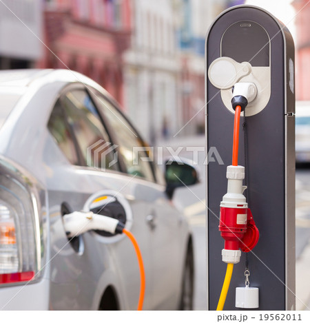 Electric Car in Charging Station. Electric Car in Charging Station. 19562011