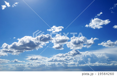 Bright sunny clouds against blue sky Bright sunny clouds against blue sky 19564260