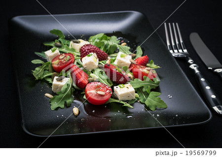 Strawberry tomato salad, feta cheese, olive oil 19569799