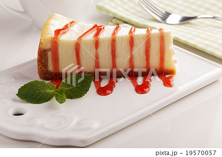 Cheesecake under strawberry sauce 19570057