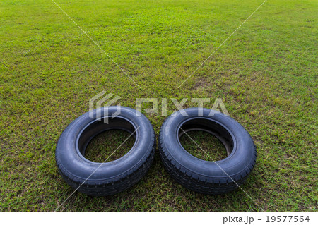 Old tires on the grass 19577564
