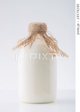 Big glass bottle of milk on the surface. Big glass bottle of milk on the surface. 19578280