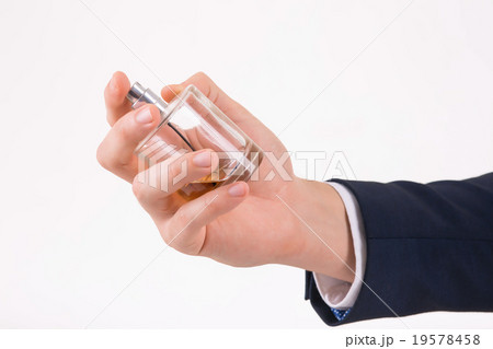 Male hand holding a perfume. Male hand holding a perfume. 19578458