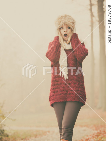 Pretty amazed fashion woman in fur winter hat. Pretty amazed fashion woman in fur winter hat. 19579709