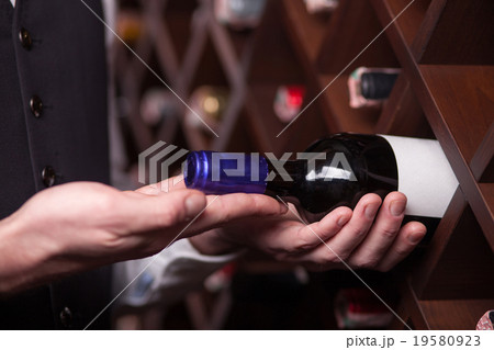 Experienced male worker is choosing drink in 19580923