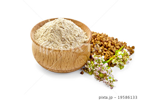 Flour buckwheat in bowl with cereals and flower 19586133