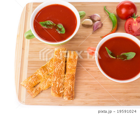 Bowl of tomato soup with basil. 19591024
