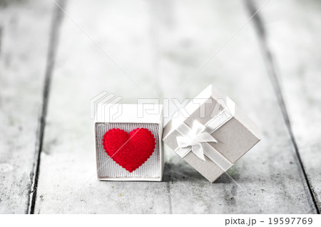 Gift box with heart on wooden table, Valentine day Gift box with heart on wooden table, Valentine day 19597769