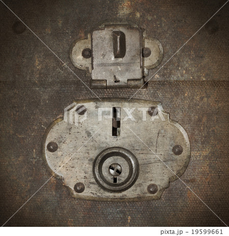 Old canvas trunk lock close up 19599661