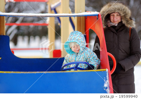 Beautiful woman and her little grandson at the winter 19599940
