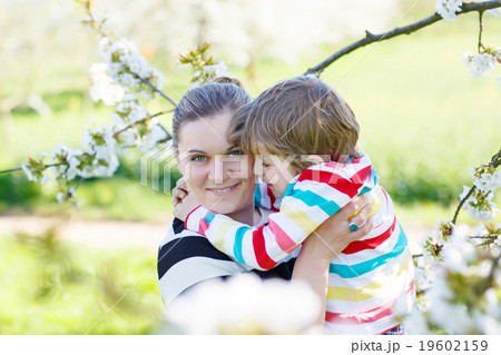 Young mother and little kid boy having fun in 19602159