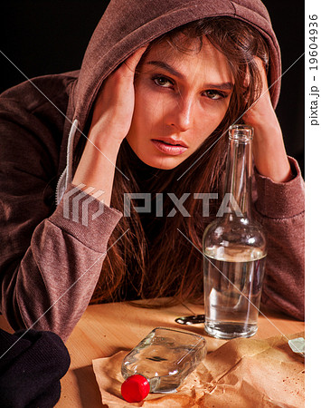 Drunk girl holding bottle of vodka. Drunk girl holding bottle of vodka. 19604936