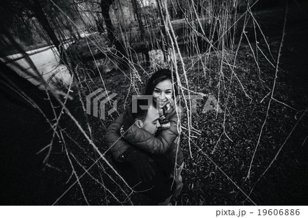 beautiful couple posing near a frozen river beautiful couple posing near a frozen river 19606886