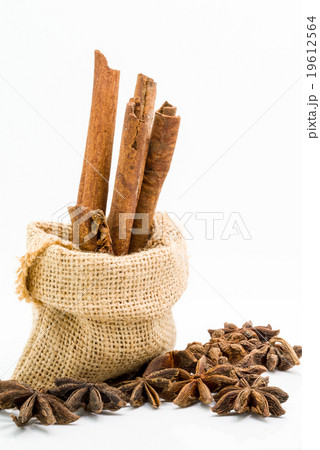 Cinnamon sticks in sack bag with star anise Cinnamon sticks in sack bag with star anise 19612564