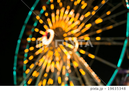 Blurry, Ferris wheel with long exposure at night. 19635348