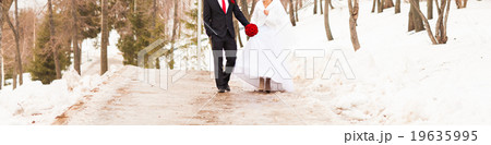 bride and groom in the winter woods bride and groom in the winter woods 19635995