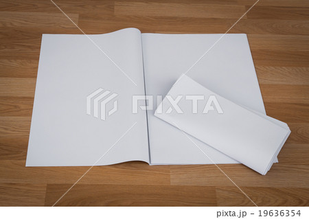Blank Newspaper with empty space mock up on wood background Blank Newspaper with empty space mock up on wood background 19636354