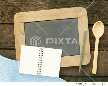 The slate chalkboard and wooden spoon 19636613