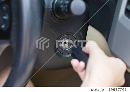 Female hand putting key in car. Female hand putting key in car. 19637761
