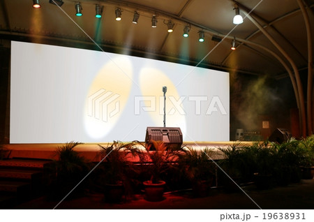 On stage performing live with microphone On stage performing live with microphone 19638931