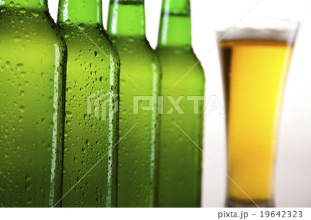 Beer bottle and glass, bright vibrant alcohol  19642323