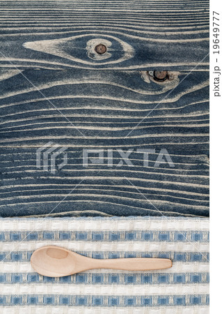 Wooden Spoon on Napkin and Blue Wooden Background Wooden Spoon on Napkin and Blue Wooden Background 19649777