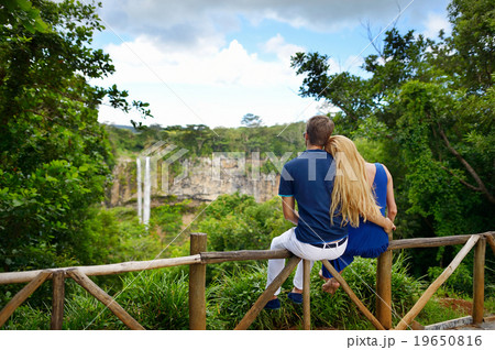 Young couple enjoying a view on Chamarel falls 19650816