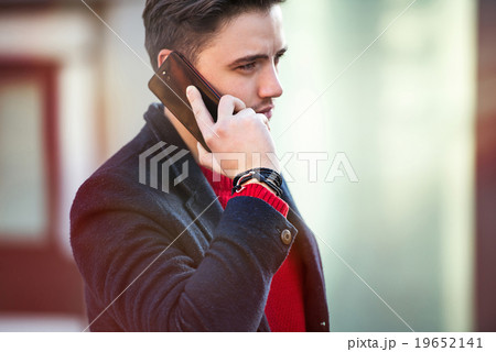 Successful businessman walking, talking on phone Successful businessman walking, talking on phone 19652141