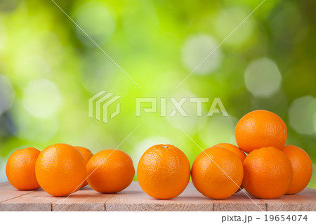 Fresh orange on wood with blur bokeh background 19654074