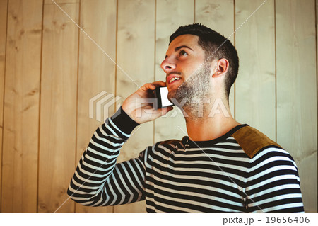 Casual hipster using his phone 19656406