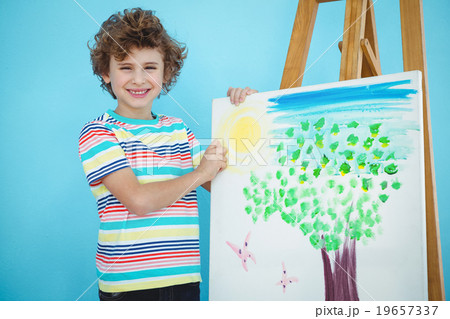 Smiling boy with his picture Smiling boy with his picture 19657337