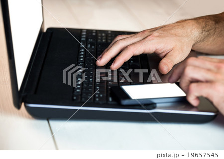 Man using his laptop Man using his laptop 19657545