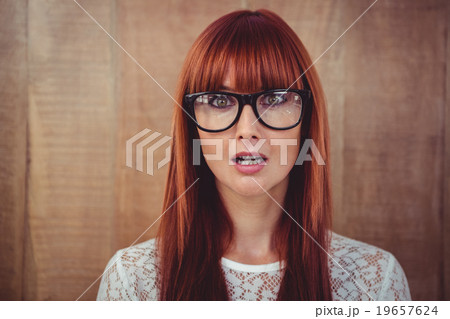 Surprised hipster woman posing face to the camera Surprised hipster woman posing face to the camera 19657624