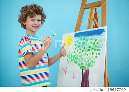 Happy boy painting his picture 19657760