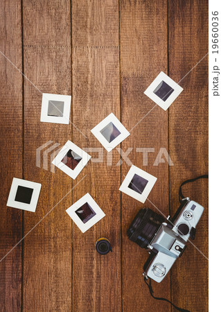 View of an old camera with photos slides View of an old camera with photos slides 19660036