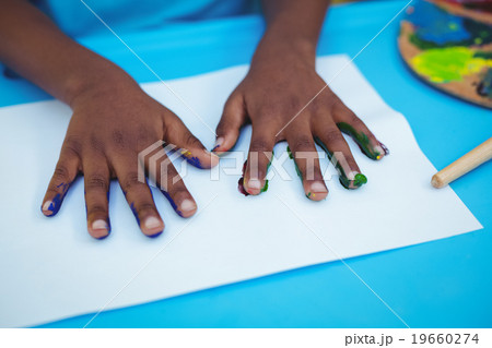Hands with paint on them on paper Hands with paint on them on paper 19660274