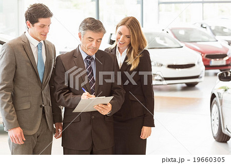Group of smiling business team standing together 19660305