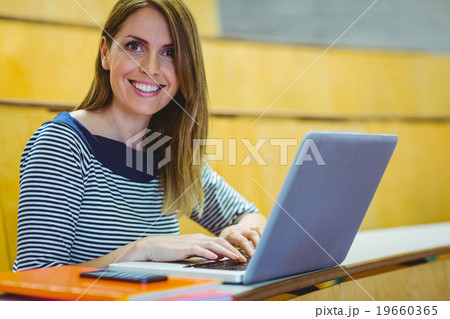 Mature student in lecture hall Mature student in lecture hall 19660365